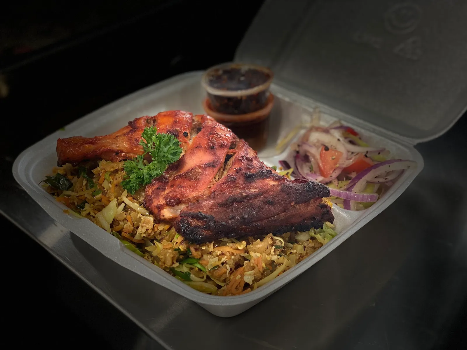 Grilled pork ribs and meat on a catering platter